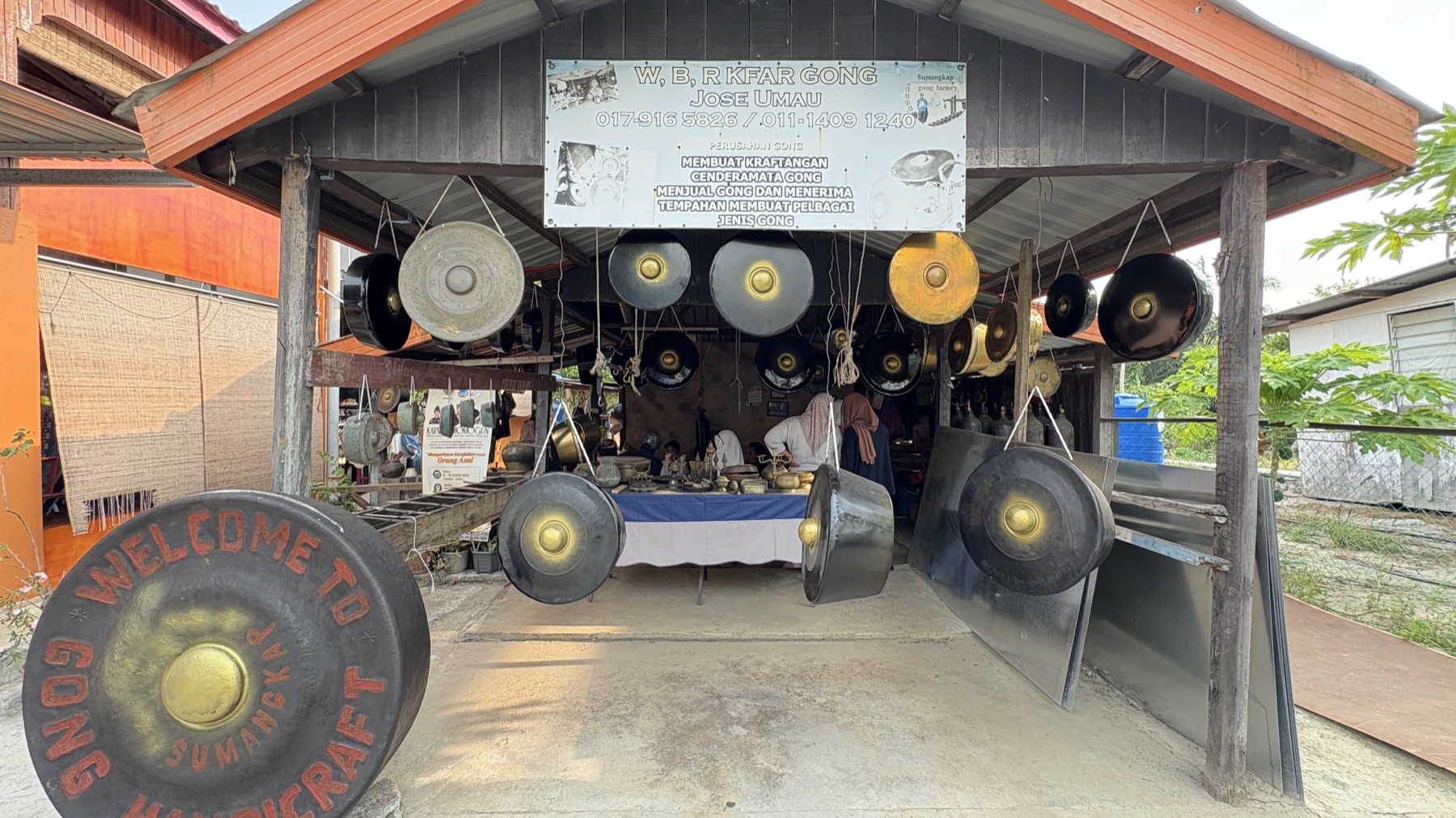 A display of gongs at a traditional gong maker's workshop